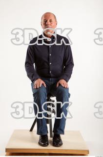 Sitting pose blue deep shirt jeans of Ed 0007